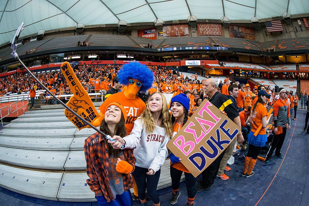 SYRACUSE, NY - FEBRUARY 14: Fans use a selfie stick to photograph the Syracuse Orange student section before the game against the Duke Blue Devils on February 14, 2015 at The Carrier Dome in Syracuse, New York. (Photo by Brett Carlsen/Getty Images)