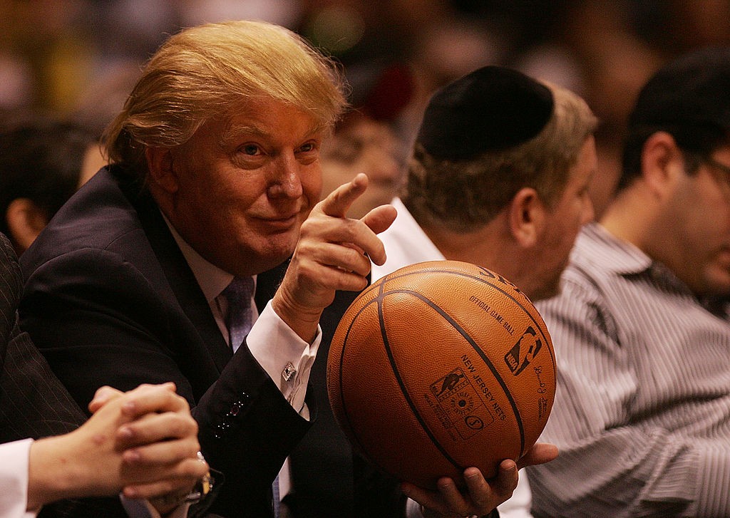 EAST RUTHERFORD, NJ - OCTOBER 31: Donald Trump sits courtside at the New Jersey Nets and the Chicago Bulls game at the Izod Center on October 31, 2007 in East Rutherford, New Jersey. NOTE TO USER: User expressly acknowledges and agrees that, by downloading and or using this photograph, user is consenting to the term and conditions of the Getty Images License Agreement (Photo by Nick Laham/Getty Images)