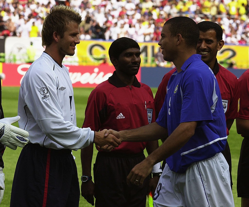SHIZUOKA - JUNE 21: David Beckham (left) of England and Ronaldo (right) of Brazil shake hands before the England v Brazil World Cup Quarter Final match played at the Shizuoka Stadium Ecopa in Shizuoka, Japan on June 21, 2002. Brazil won the match 2-1. (Photo by Stu Forster/Getty Images)