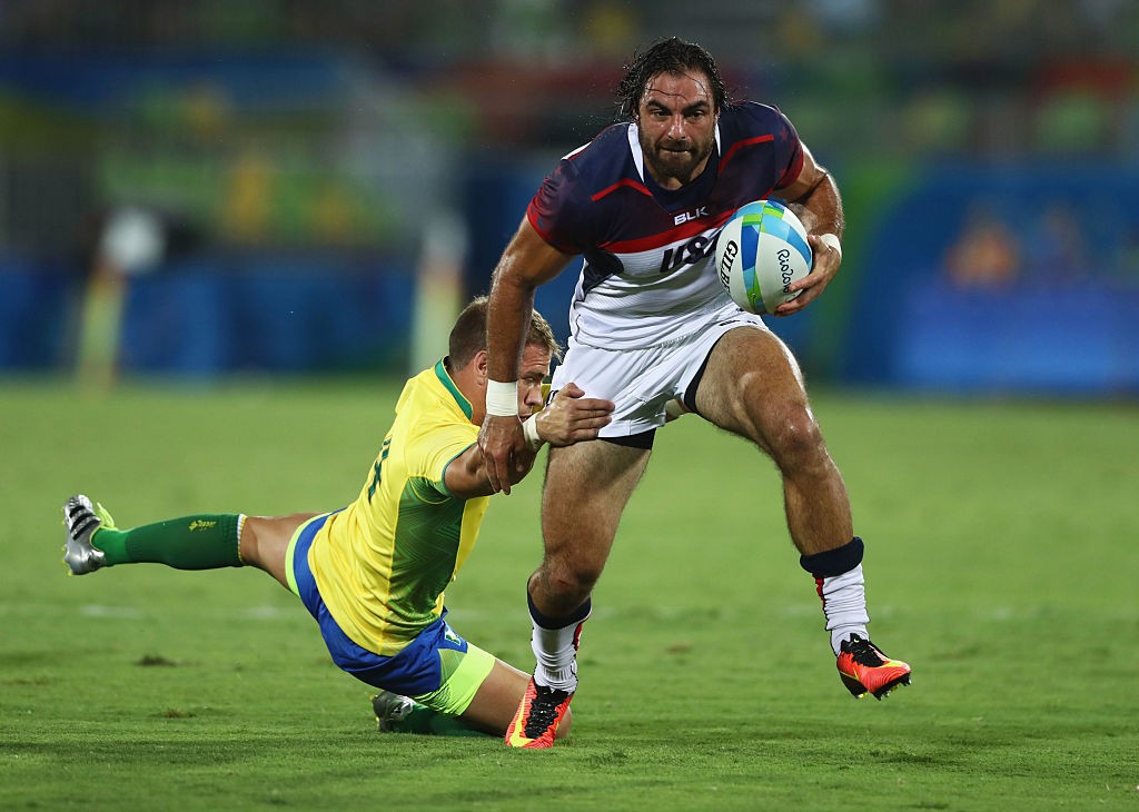 RIO DE JANEIRO, BRAZIL - AUGUST 09: Nate Ebner of the United States beats Felipe Claro of Brazil to score a try during the Men's Rugby Sevens Pool A match between the United States and Brazil on Day 4 of the Rio 2016 Olympic Games at Deodoro Stadium on August 9, 2016 in Rio de Janeiro, Brazil. (Photo by David Rogers/Getty Images)